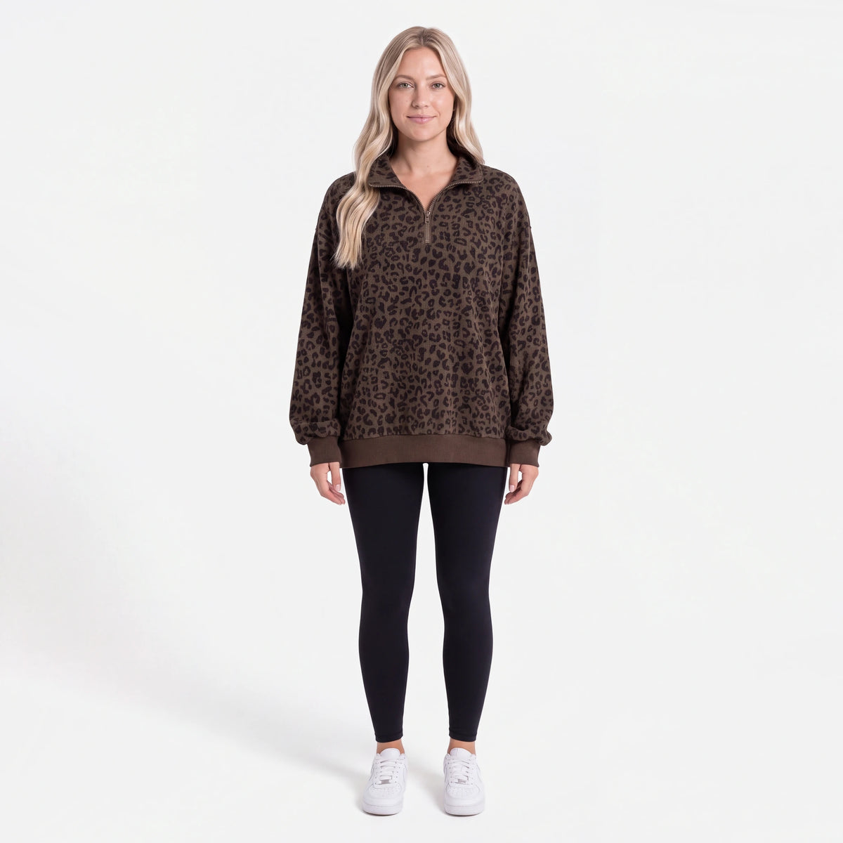 Woman wearing the Dark Brown Leopard oversized quarter zip, front view
