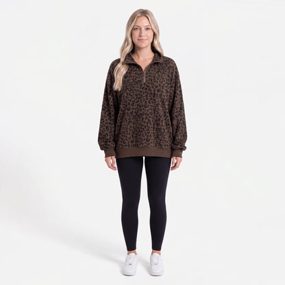 Woman wearing the Dark Brown Leopard oversized quarter zip, front view