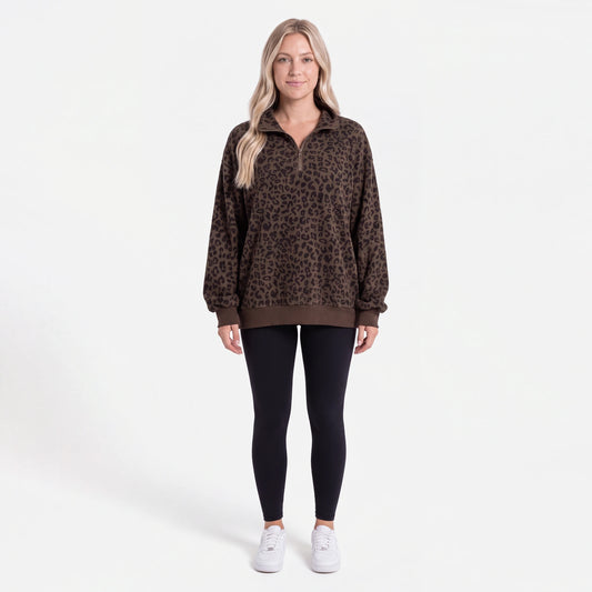 Woman wearing the Dark Brown Leopard oversized quarter zip, front view
